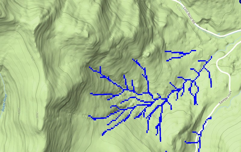 A topographic map of the Hubbard Brook forest showing elevation lines and small blue stream segments branching across the landscape. Roads labeled Lost River Road and Sawyer Highway appear on the right side.
